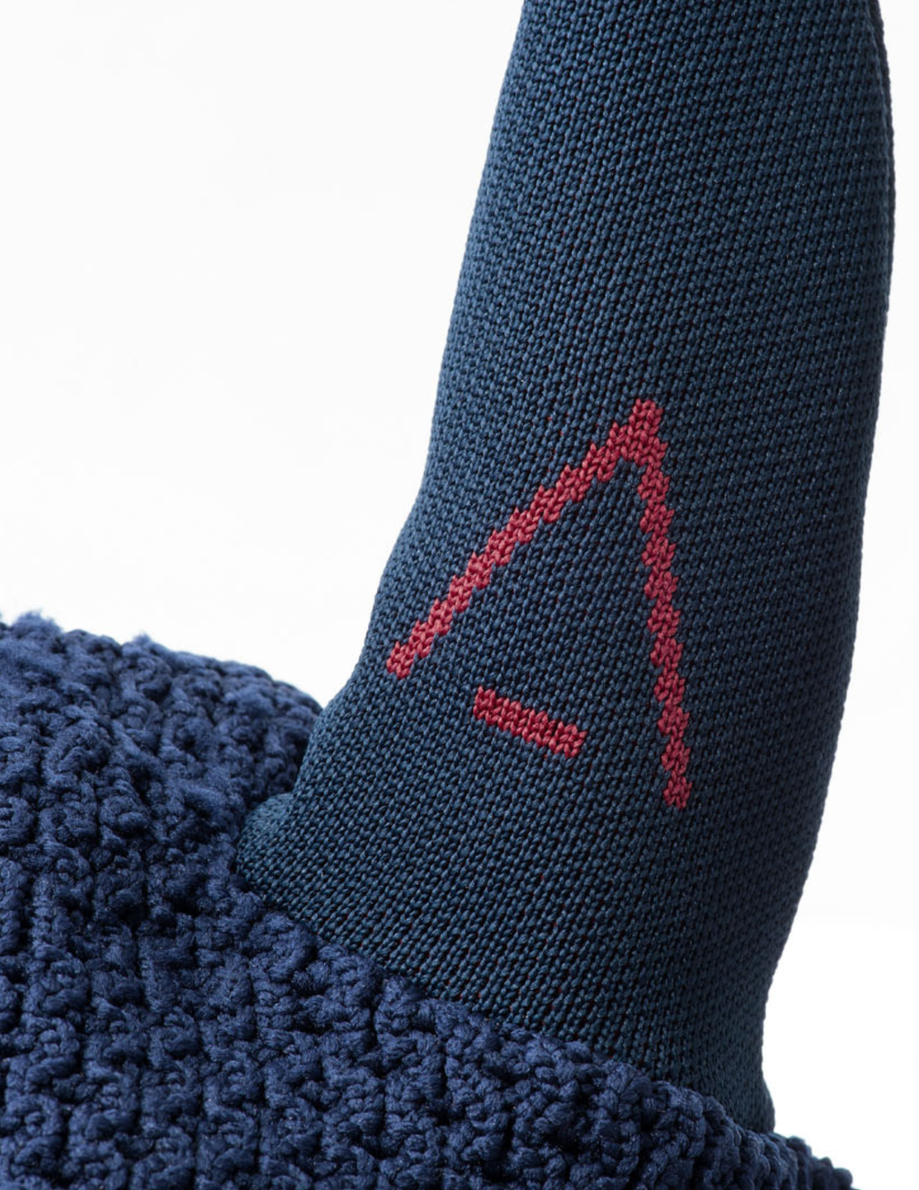 Navy INFI-KNIT ear net with a burgundy A